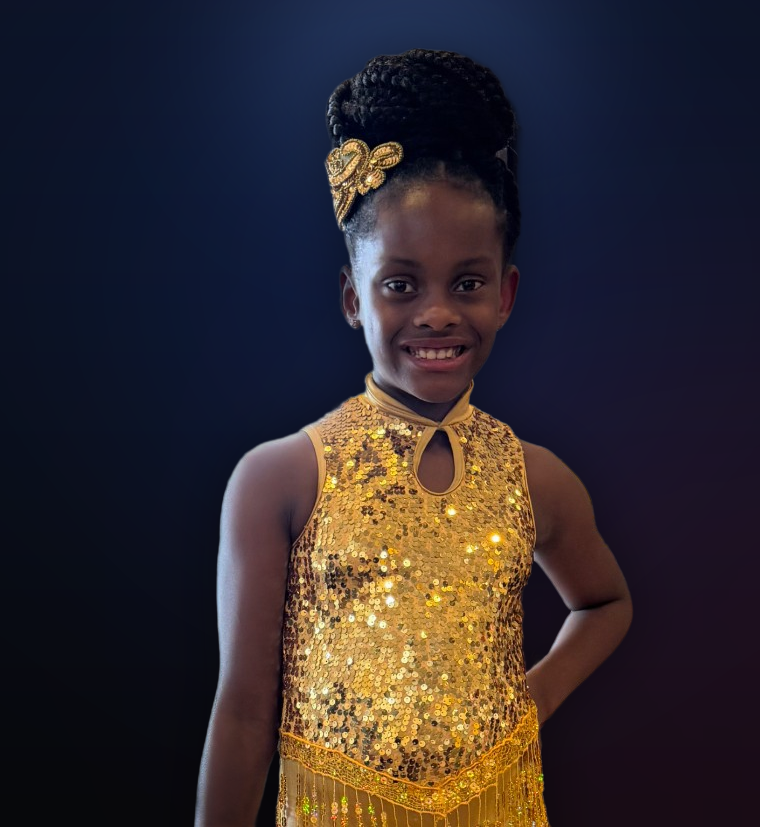 Taylor-Grace in her gold fringe dance costume